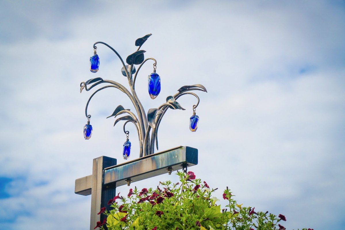 "Evening in Paris" by Rodman Miller & Anna Sherman on flower basket poles in Edmonds WA