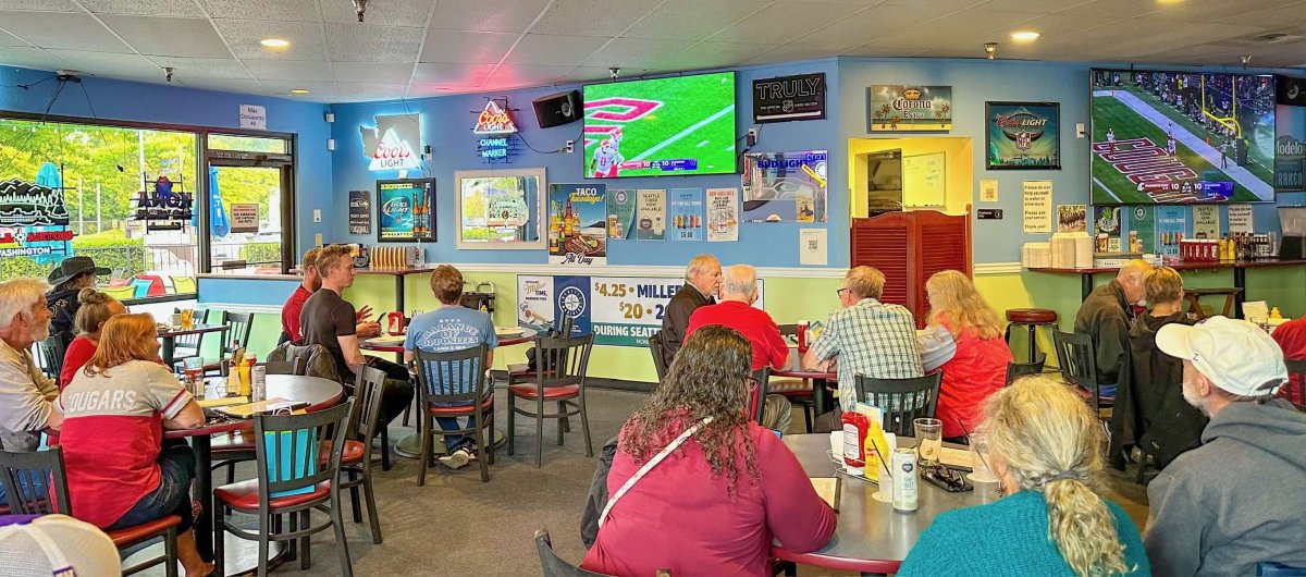 People watching football on TV at The Channel Marker Pub & Grill in Edmonds, WA