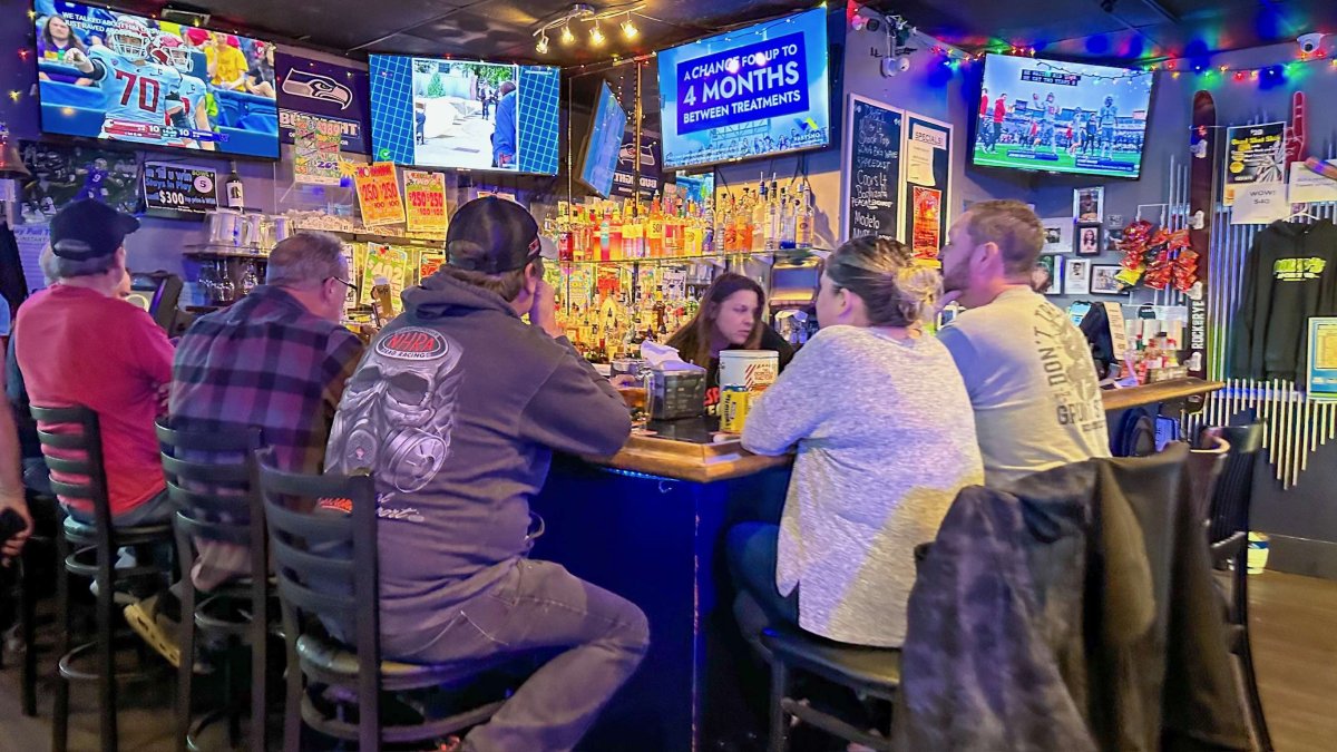 People watching sports on TV at the bar at MVP's sports bar in Edmonds, WA